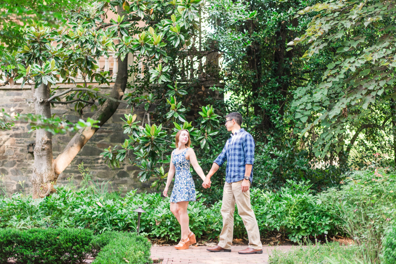 Couple at engagement session walking while holding hands