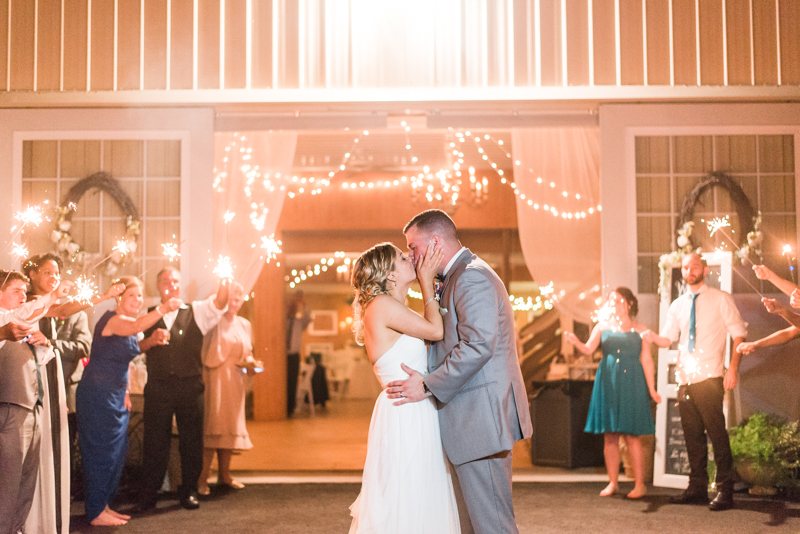 couple kissing at sparkler exit at flora corner farm wedding