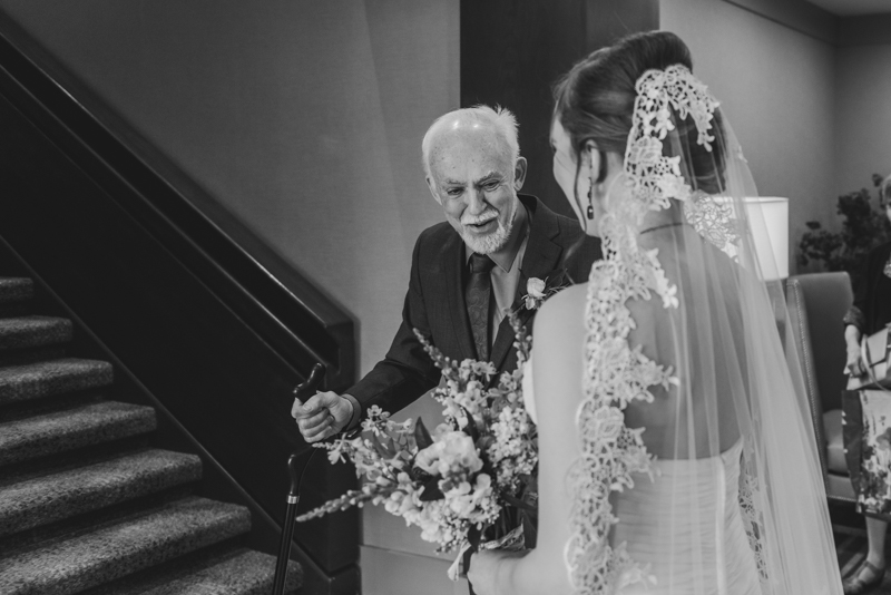 Industrial chic April wedding Father Daughter first look in Baltimore City's Radisson Hotel by Britney Clause Photography