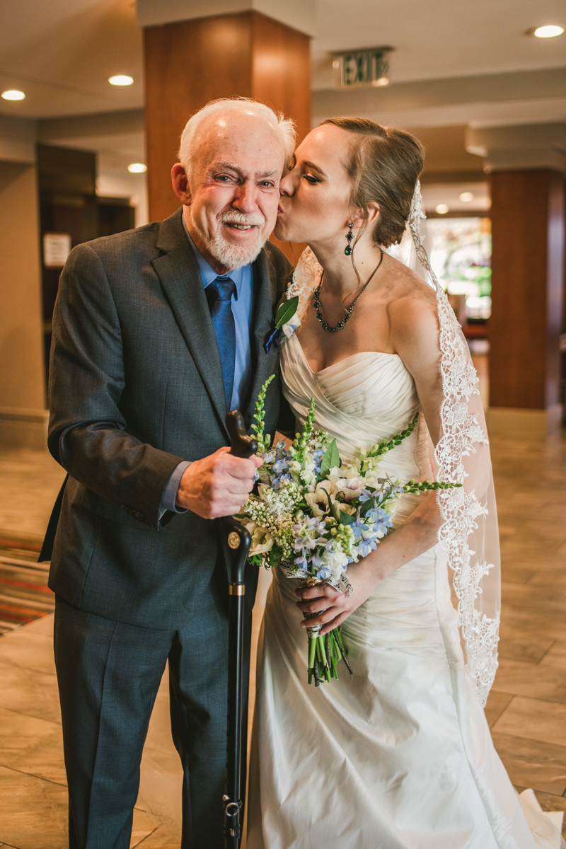 Industrial chic April wedding Father Daughter first look in Baltimore City's Radisson Hotel by Britney Clause Photography