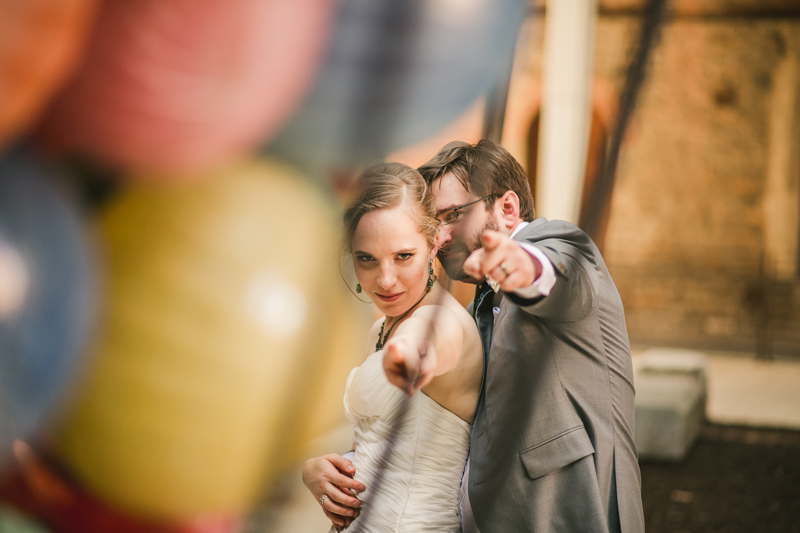 Industrial chic April wedding bride and groom portraits in Baltimore City at Clipper Mill glass sculpture by Britney Clause Photography