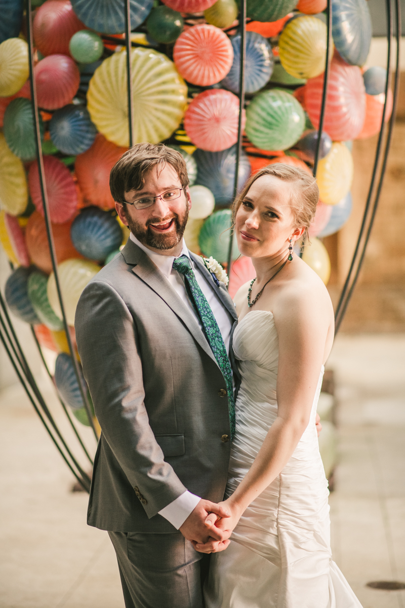 Industrial chic April wedding bride and groom portraits in Baltimore City at Clipper Mill glass sculpture by Britney Clause Photography