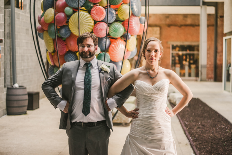 Industrial chic April wedding bride and groom portraits in Baltimore City at Clipper Mill glass sculpture by Britney Clause Photography