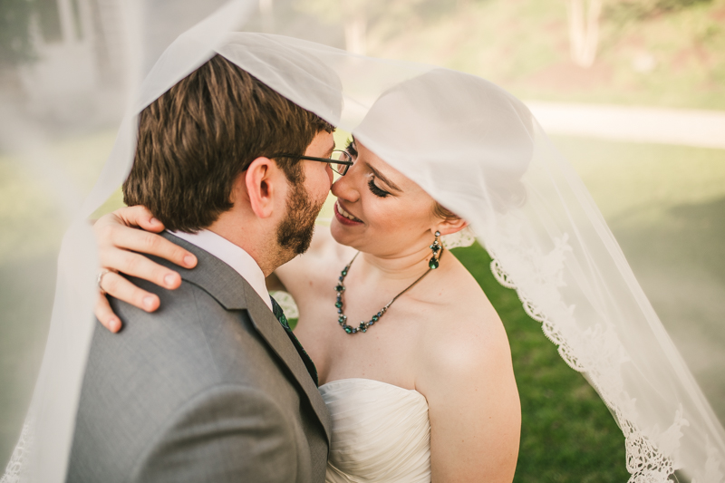 Industrial chic April wedding after party bride and groom portraits veil shot in Baltimore City at Union Mill Apartments by Britney Clause Photography