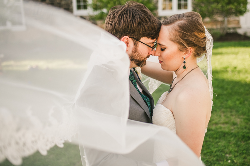 Industrial chic April wedding after party bride and groom portraits veil shot in Baltimore City at Union Mill Apartments by Britney Clause Photography