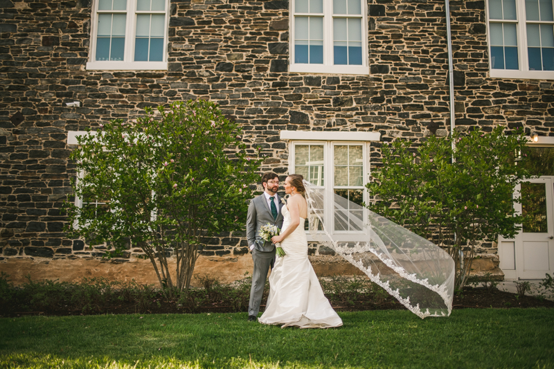 Industrial chic April wedding after party bride and groom portraits veil shot in Baltimore City at Union Mill Apartments by Britney Clause Photography