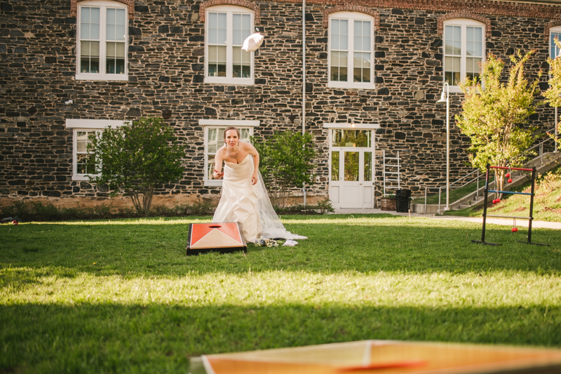 Industrial chic April wedding after party cornhole in Baltimore City at Union Mill Apartments by Britney Clause Photography