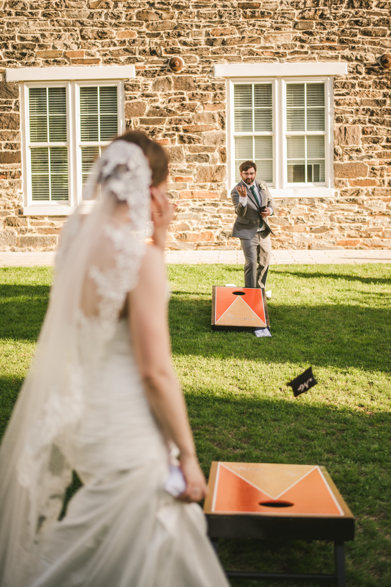 Industrial chic April wedding after party cornhole in Baltimore City at Union Mill Apartments by Britney Clause Photography