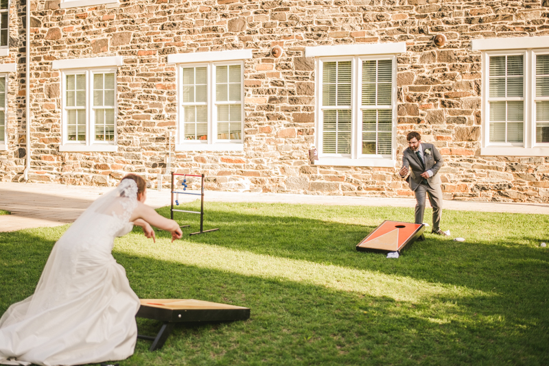 Industrial chic April wedding after party cornhole in Baltimore City at Union Mill Apartments by Britney Clause Photography