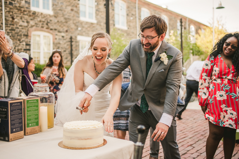 Industrial chic April wedding after party cake cutting in Baltimore City at Union Mill Apartments by Britney Clause Photography