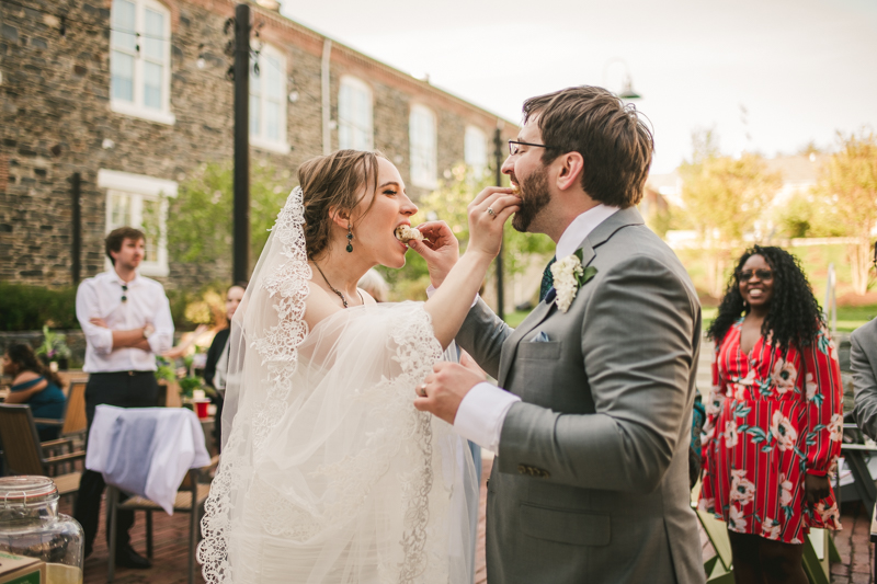 Industrial chic April wedding after party cake cutting in Baltimore City at Union Mill Apartments by Britney Clause Photography