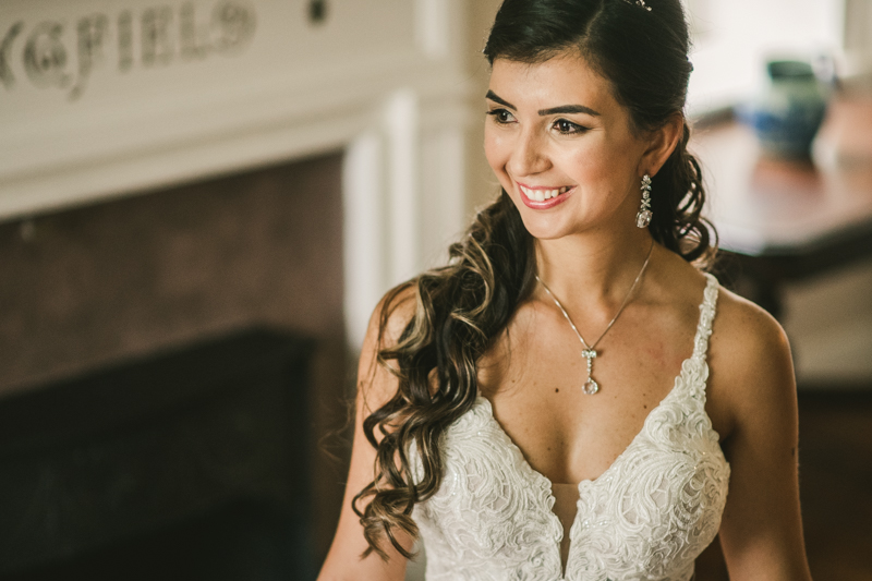 A beautiful stormy April wedding at Springfield Manor in Thurmont Maryland wedding dress from Cameo Bridal with makeup and hair styled by Airbrush Faces