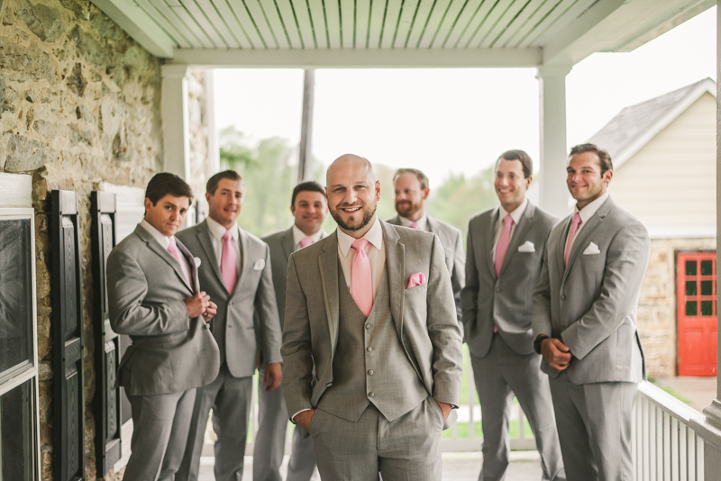 A beautiful stormy April wedding at Springfield Manor in Thurmont Maryland groomsmen on the front porch