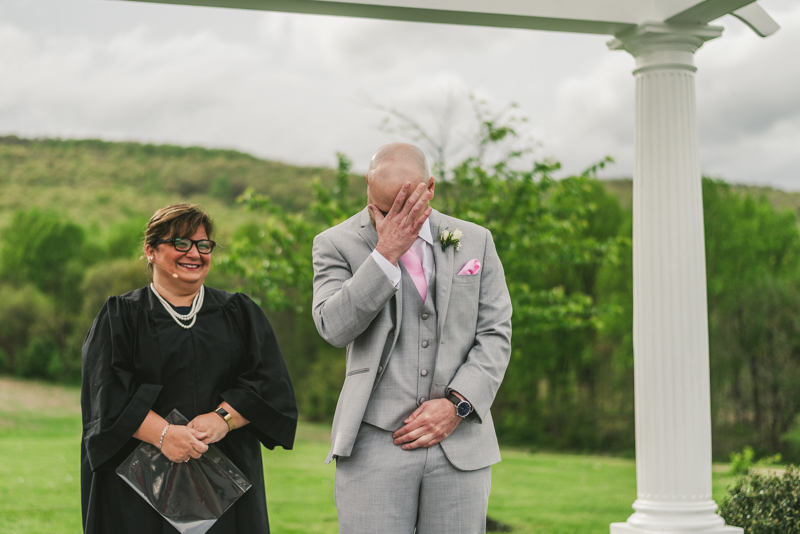 A beautiful stormy April wedding ceremony at Springfield Manor with an emotional groom in Thurmont Maryland