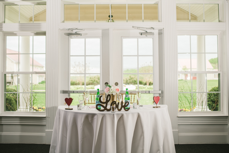 A beautiful stormy April wedding reception sweetheart table at Springfield Manor in Thurmont Maryland 