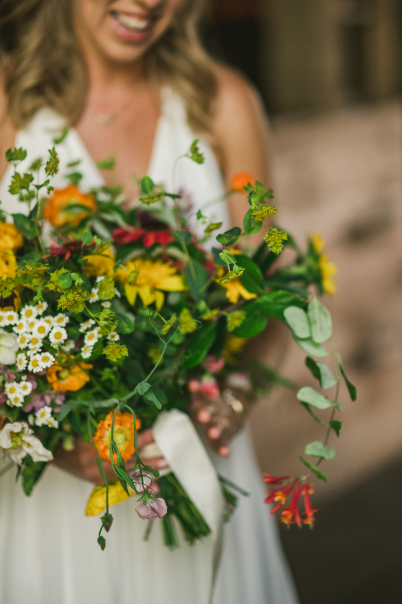 Gorgeous summer wedding florals by Sungold Flower Co at Rocklands Farm Winery in Poolesville, Maryland by Britney Clause Photography a husband and wife wedding photographer team in Maryland