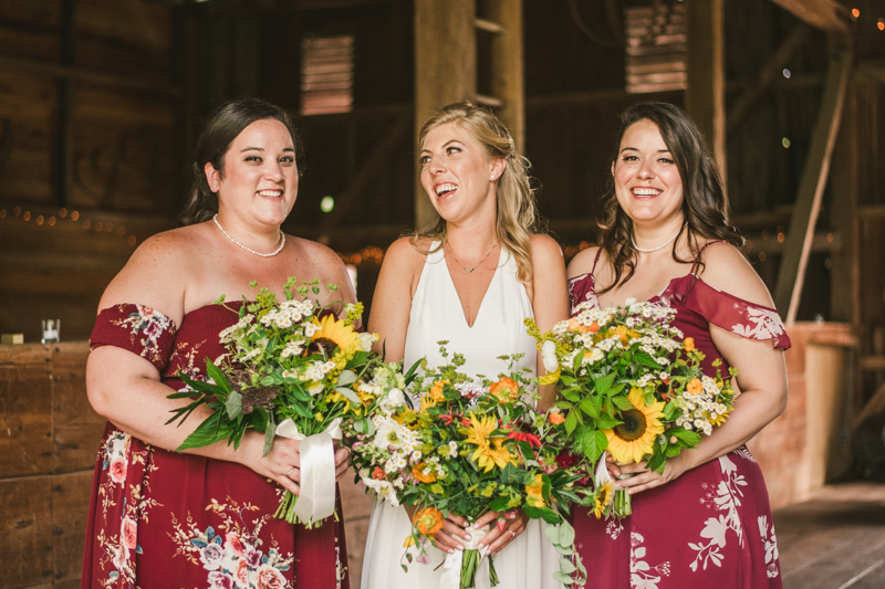 Gorgeous summer wedding florals by Sungold Flower Co at Rocklands Farm Winery in Poolesville, Maryland by Britney Clause Photography a husband and wife wedding photographer team in Maryland