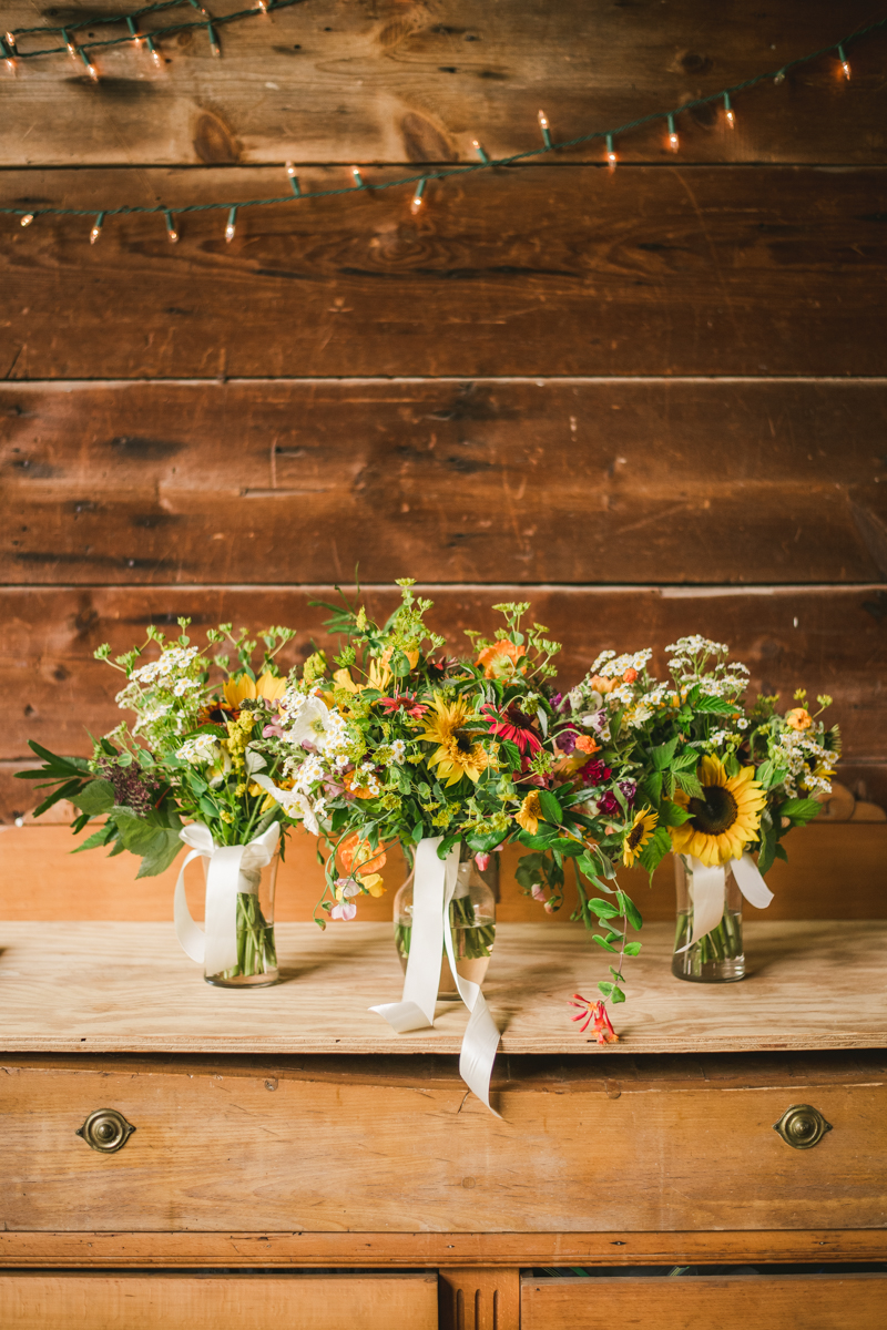 Gorgeous summer wedding florals by Sungold Flower Co at Rocklands Farm Winery in Poolesville, Maryland by Britney Clause Photography a husband and wife wedding photographer team in Maryland