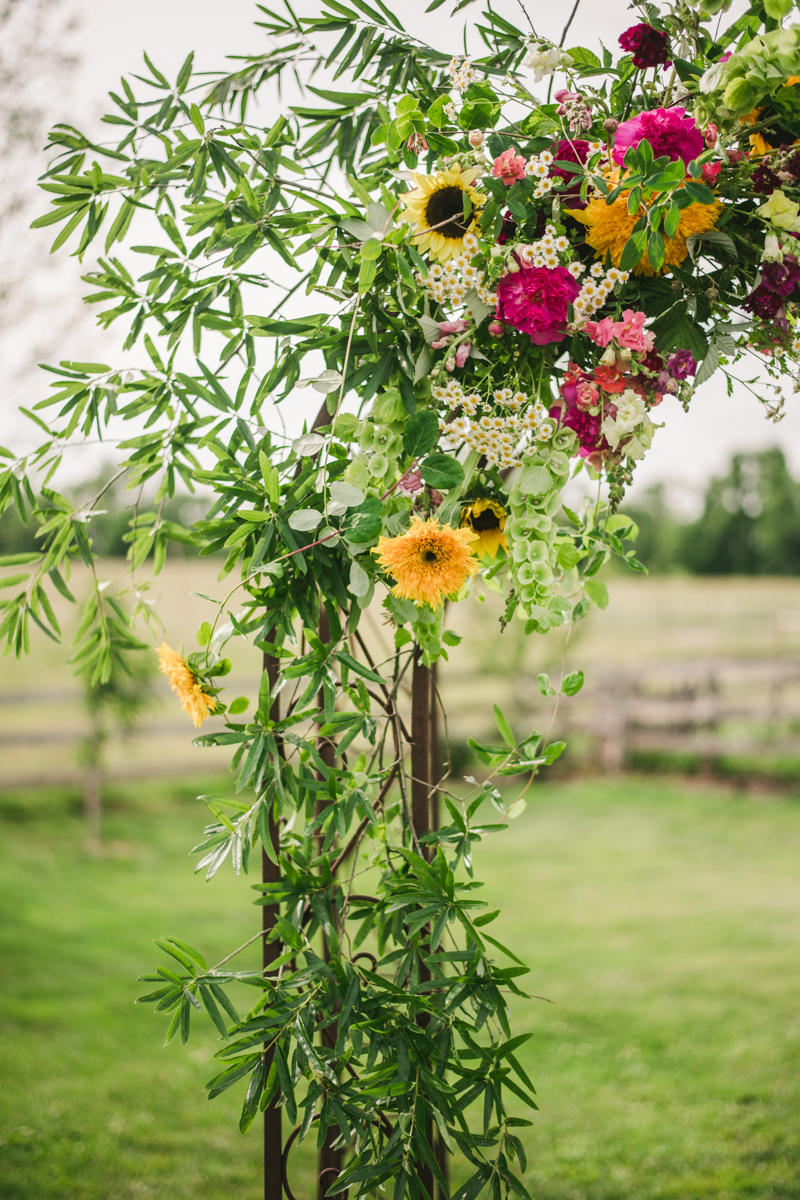 Gorgeous summer wedding florals by Sungold Flower Co at Rocklands Farm Winery in Poolesville, Maryland by Britney Clause Photography a husband and wife wedding photographer team in Maryland