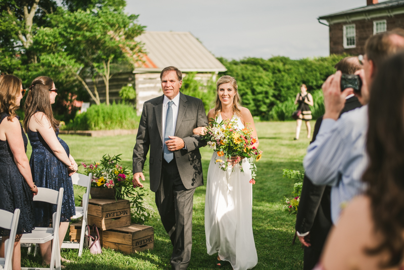 A gorgeous summer wedding ceremony at Rocklands Farm Winery in Poolesville, Maryland by Britney Clause Photography a husband and wife wedding photographer team in Maryland