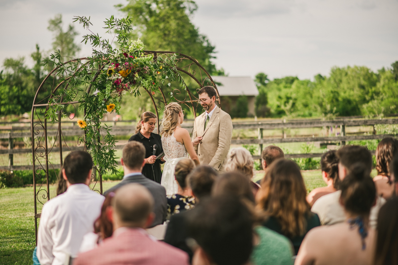 A gorgeous summer wedding ceremony at Rocklands Farm Winery in Poolesville, Maryland by Britney Clause Photography a husband and wife wedding photographer team in Maryland