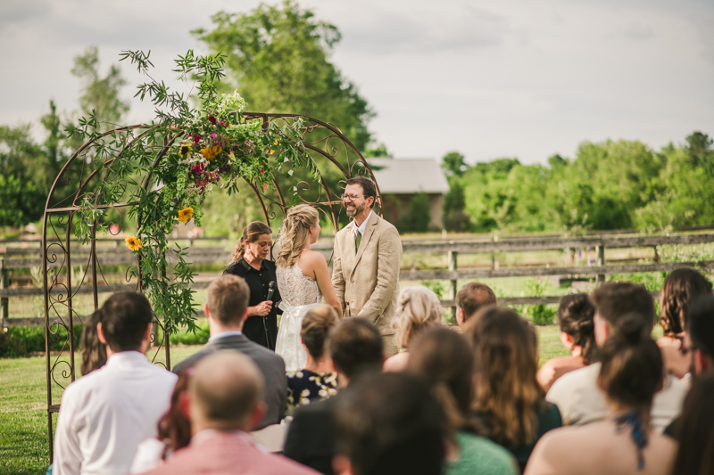 A gorgeous summer wedding ceremony at Rocklands Farm Winery in Poolesville, Maryland by Britney Clause Photography a husband and wife wedding photographer team in Maryland