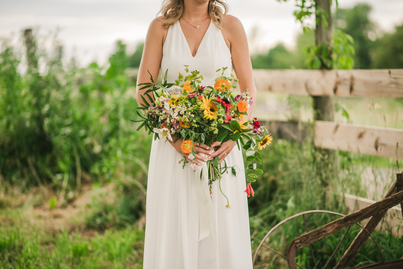 Gorgeous summer wedding florals by Sungold Flower Co at Rocklands Farm Winery in Poolesville, Maryland by Britney Clause Photography a husband and wife wedding photographer team in Maryland