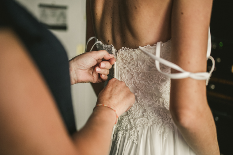 A bride getting ready for her wedding at Governor Calvert House in Downtown Annapolis by Britney Clause Photography, wedding photographers in Maryland