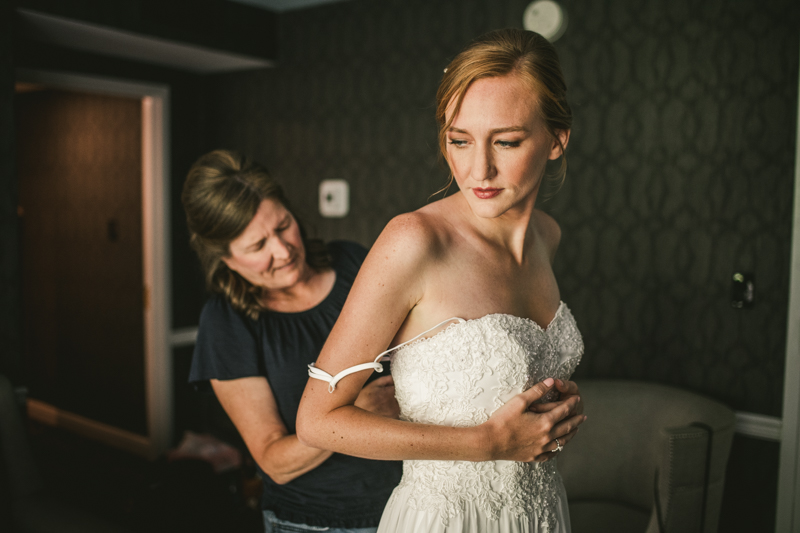 A bride getting ready for her wedding at Governor Calvert House in Downtown Annapolis by Britney Clause Photography, wedding photographers in Maryland