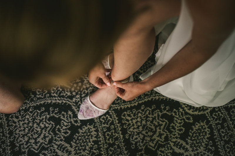 A bride getting ready for her wedding at Governor Calvert House in Downtown Annapolis by Britney Clause Photography, wedding photographers in Maryland