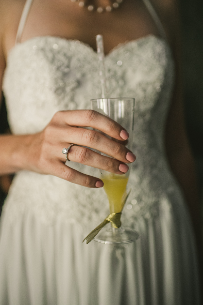 A bride getting ready for her wedding at Governor Calvert House in Downtown Annapolis by Britney Clause Photography, wedding photographers in Maryland