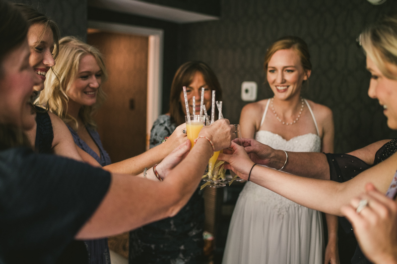 A bride getting ready for her wedding at Governor Calvert House in Downtown Annapolis by Britney Clause Photography, wedding photographers in Maryland