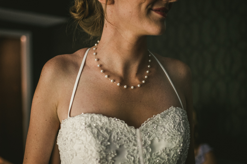 A bride getting ready for her wedding at Governor Calvert House in Downtown Annapolis by Britney Clause Photography, wedding photographers in Maryland