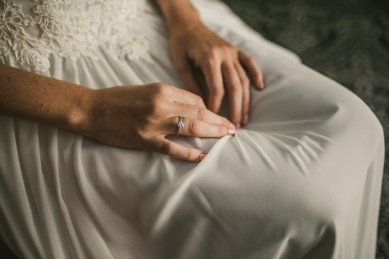 A bride getting ready for her wedding at Governor Calvert House in Downtown Annapolis by Britney Clause Photography, wedding photographers in Maryland