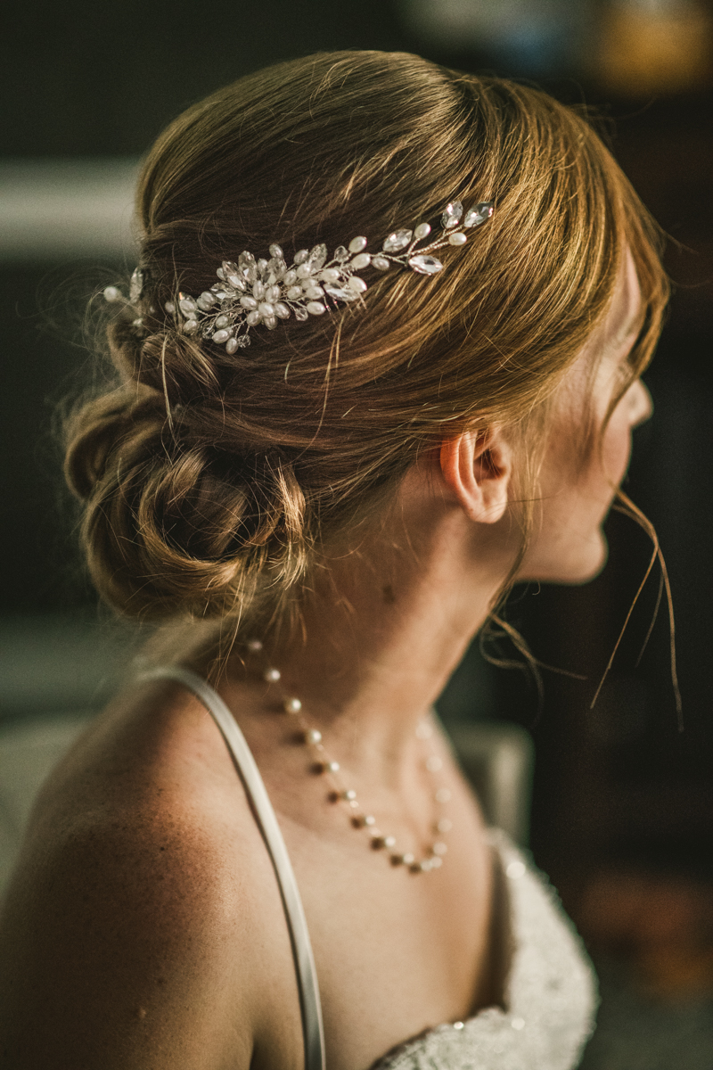 A bride getting ready for her wedding at Governor Calvert House in Downtown Annapolis by Britney Clause Photography, wedding photographers in Maryland