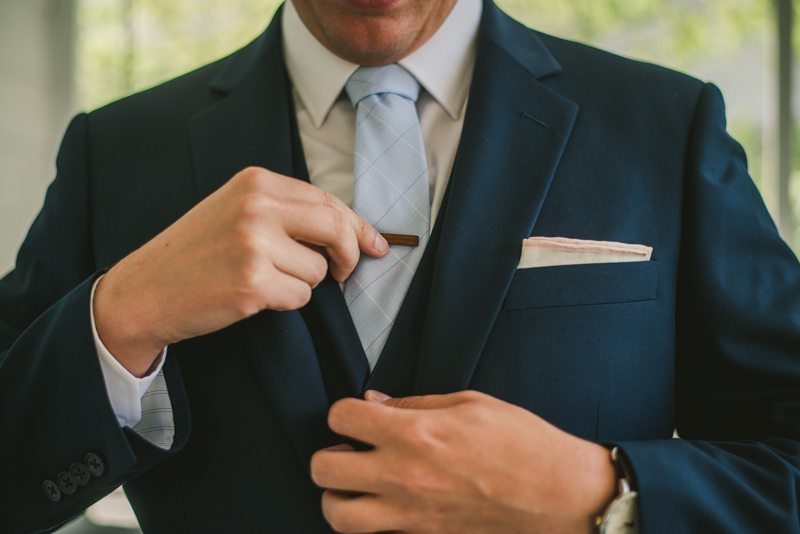 A groom getting ready for his wedding at an AirBnB in Annapolis by Britney Clause Photography, wedding photographers in Maryland