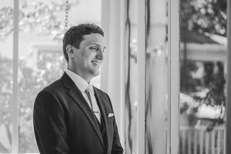 A groom getting ready for his wedding at an AirBnB in Annapolis by Britney Clause Photography, wedding photographers in Maryland