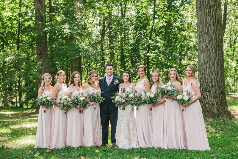 Posing a gorgeous large bridal party at Liriodendron Mansion in Bel Air, Maryland by Britney Clause Photography