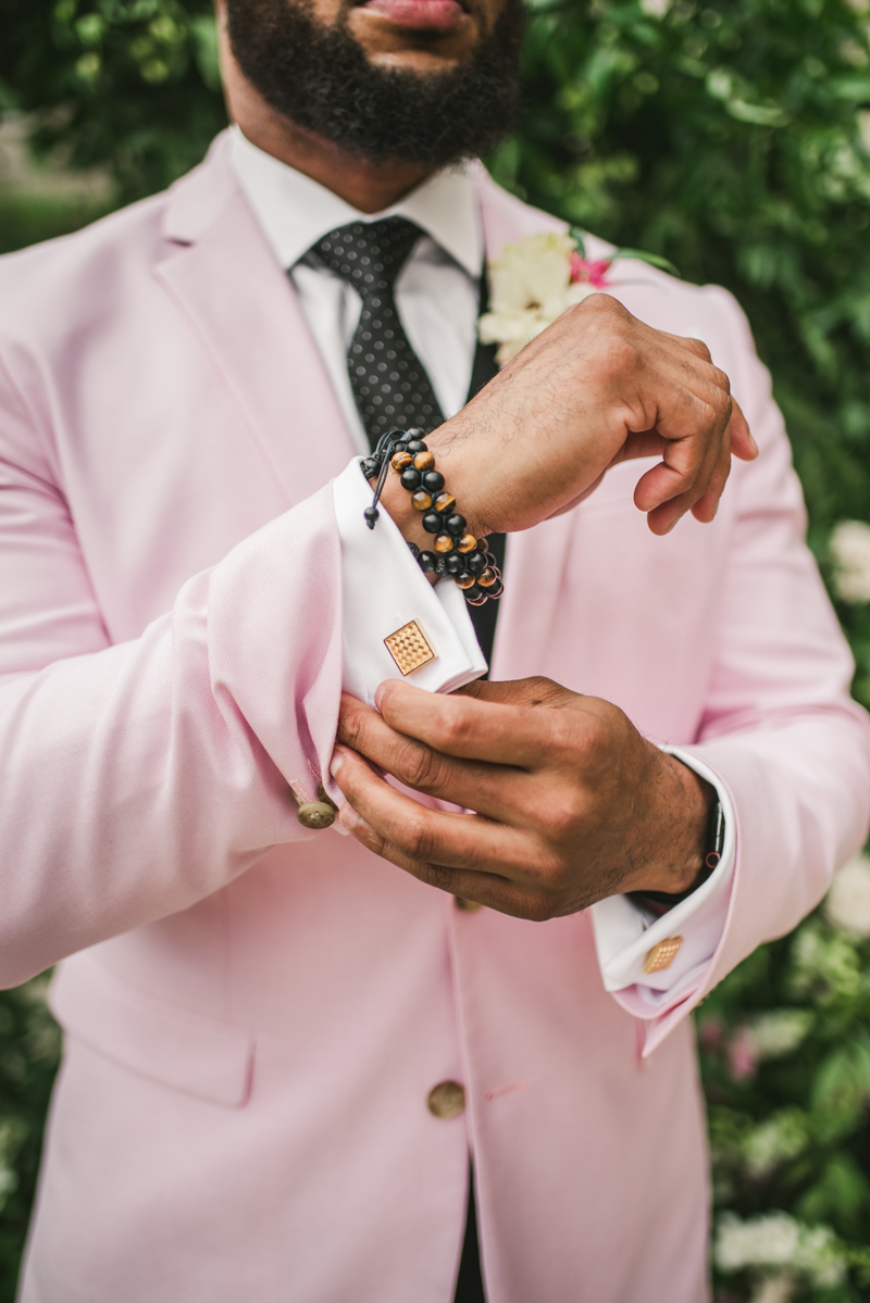 Handsome groom getting ready at Main Street Ballroom in Ellicott City by Britney Clause Photography