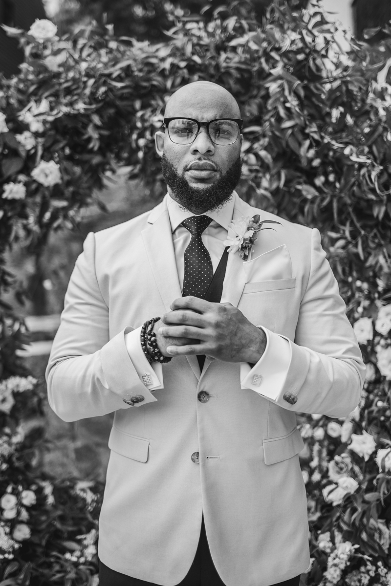 Handsome groom getting ready at Main Street Ballroom in Ellicott City by Britney Clause Photography