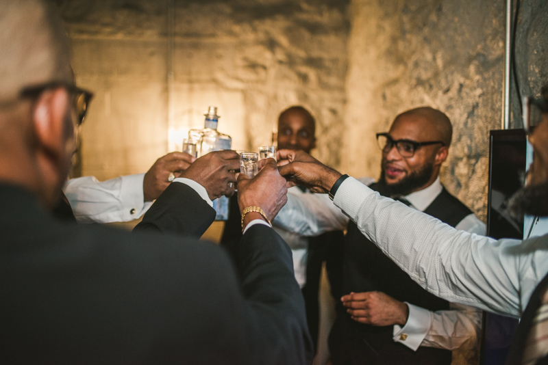 Handsome groom getting ready at Main Street Ballroom in Ellicott City by Britney Clause Photography