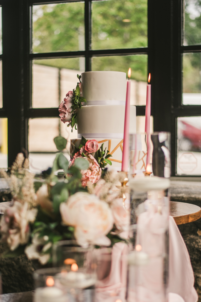 Beautiful wedding cake from Charm City Cakes at Main Street Ballroom in Ellicott City by Britney Clause Photography