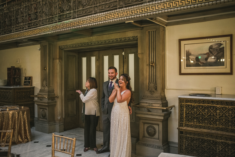 Beautiful bride and groom portraits in Mount Vernon, Maryland at the George Peabody Library by Britney Clause Photography