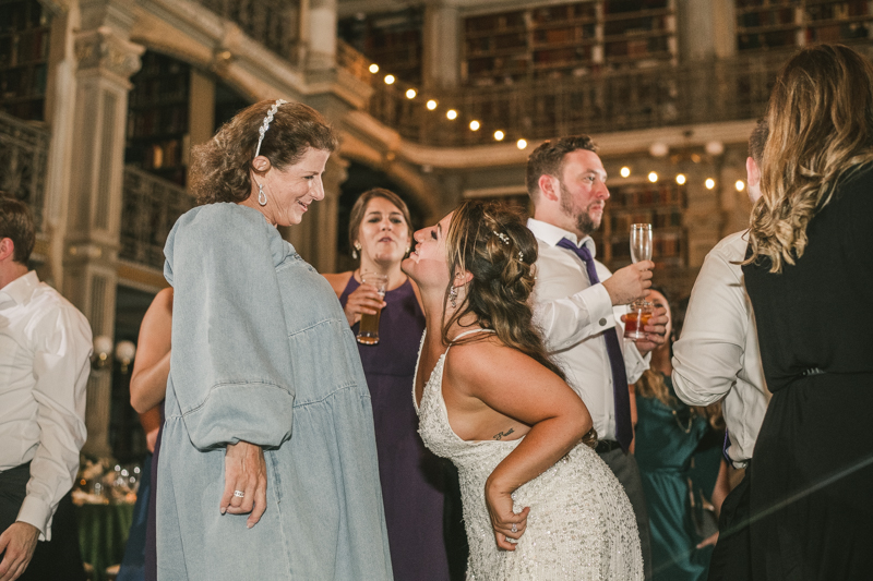 A gorgeous and fun wedding reception at the George Peabody Library in Baltimore, Maryland by Britney Clause Photography