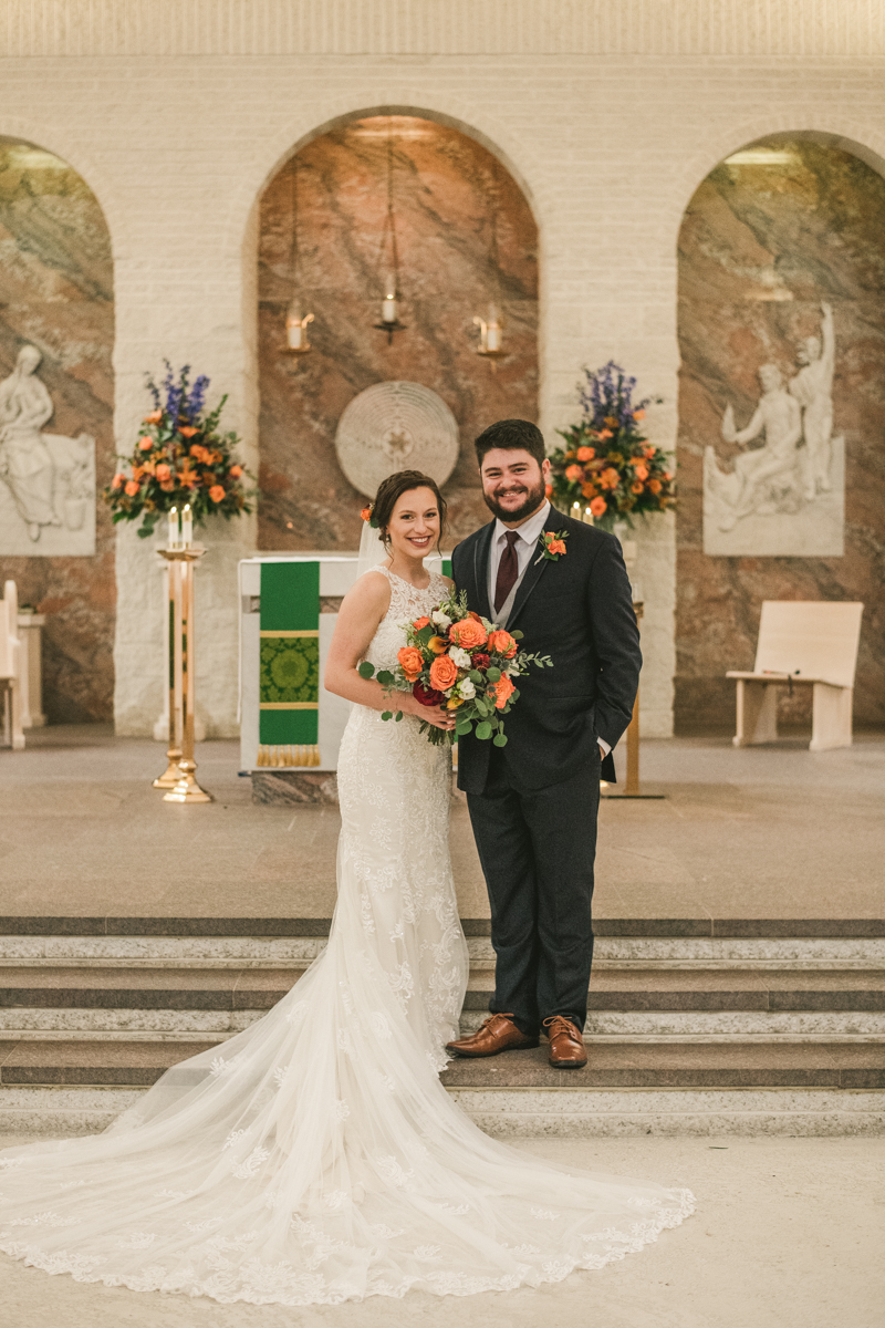 Stunning fall bride and groom just married portraits at Jesus the Good Shepherd Church in Owings in Maryland. Photo by Britney Clause Photography