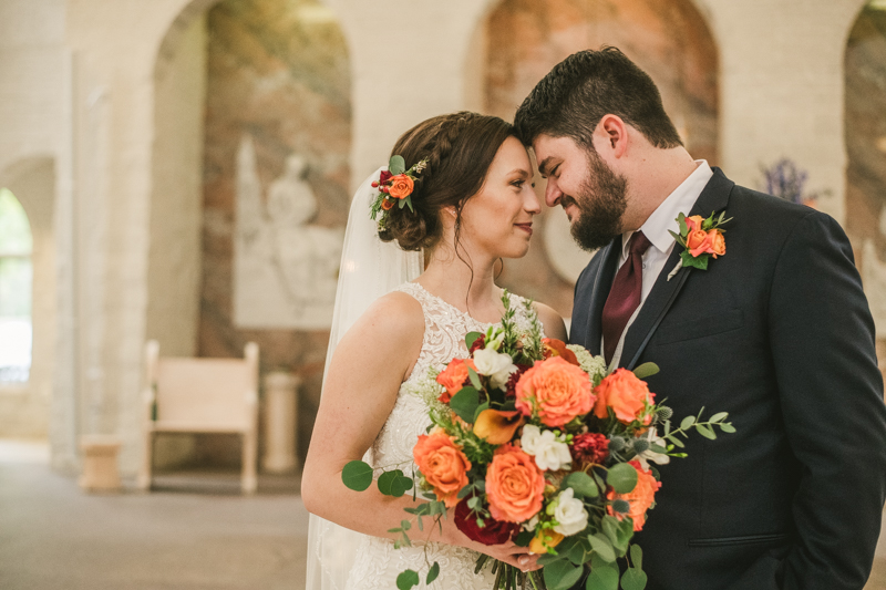Stunning fall bride and groom just married portraits at Jesus the Good Shepherd Church in Owings in Maryland. Photo by Britney Clause Photography