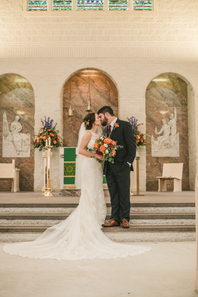 Stunning fall bride and groom just married portraits at Jesus the Good Shepherd Church in Owings in Maryland. Photo by Britney Clause Photography