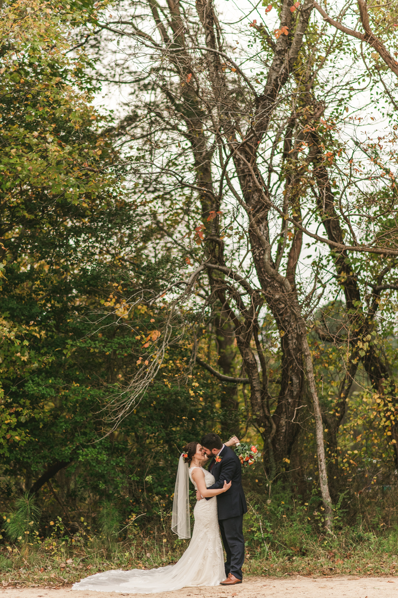 Stunning fall bride and groom just married portraits at The Barn at Pleasant Acres in Maryland. Photo by Britney Clause Photography