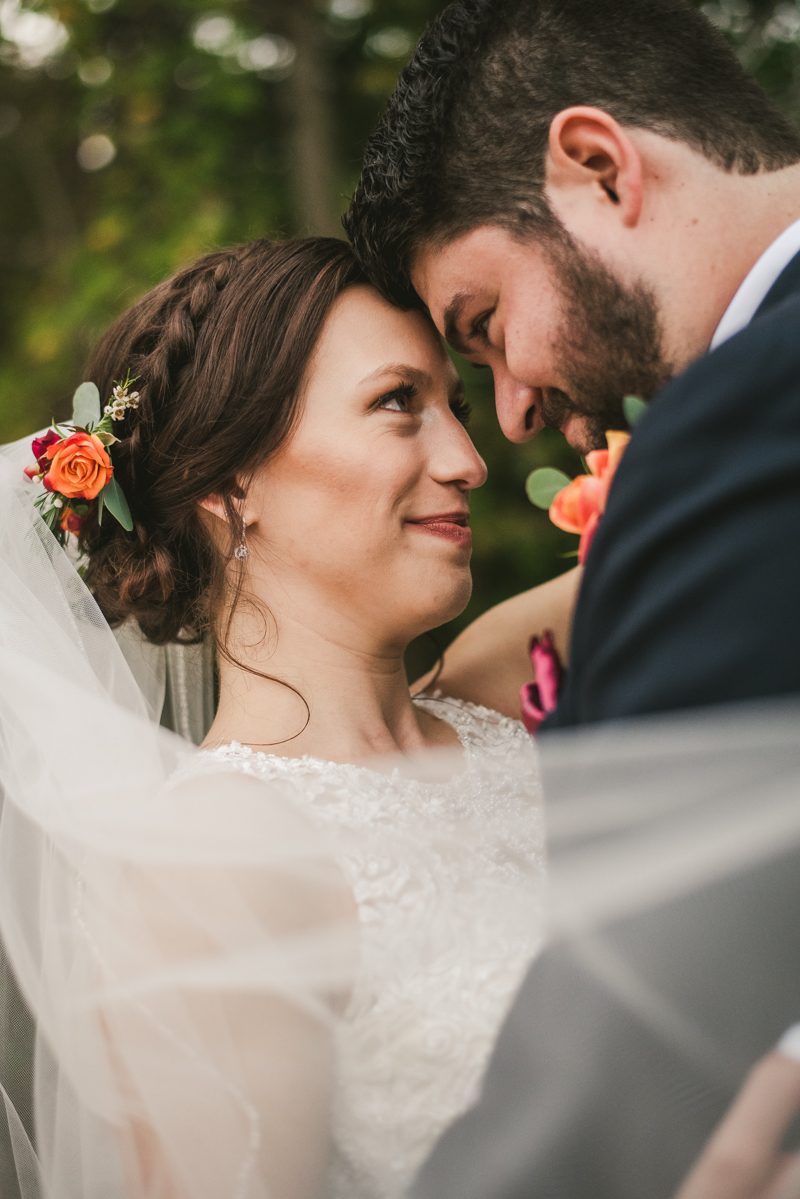 Stunning fall bride and groom just married portraits at The Barn at Pleasant Acres in Maryland. Photo by Britney Clause Photography