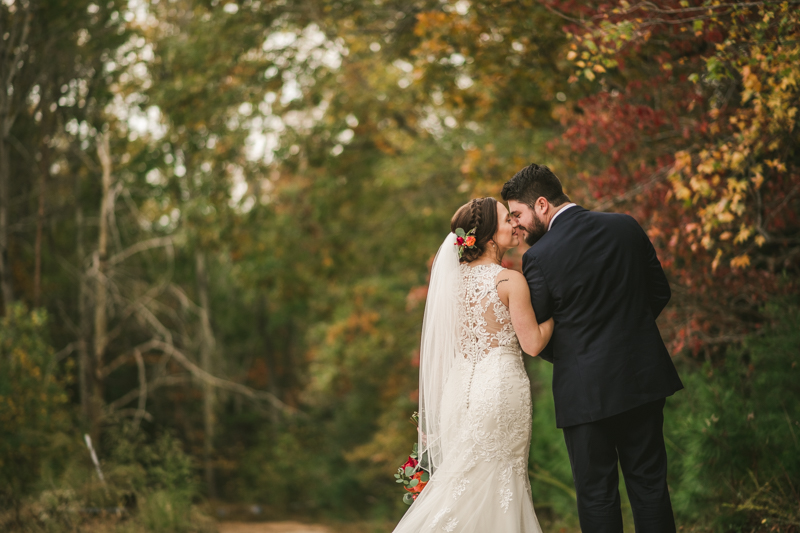 Stunning fall bride and groom just married portraits at The Barn at Pleasant Acres in Maryland. Photo by Britney Clause Photography